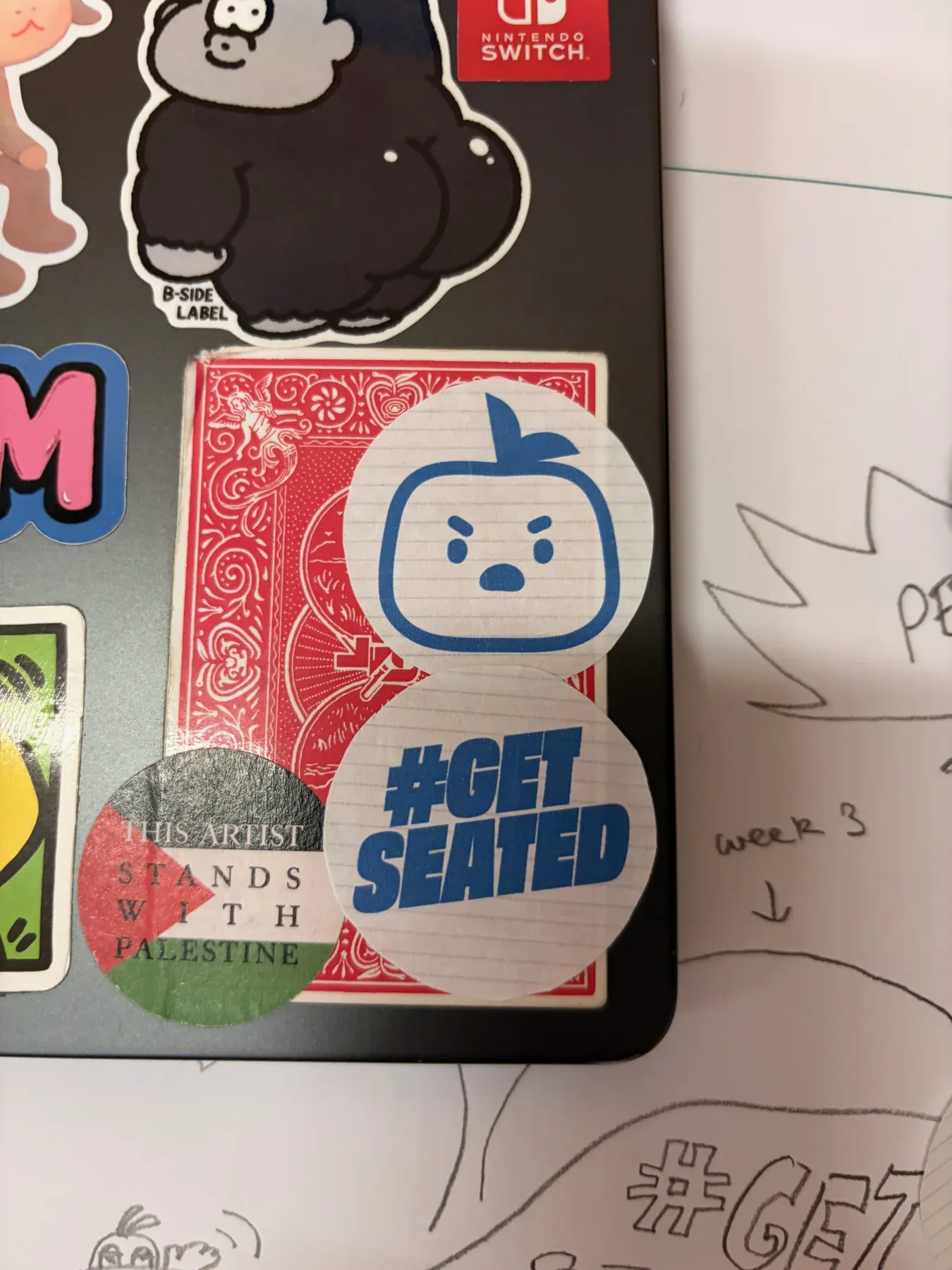 Sophie’s Sid mascot sticker on a laptop, with the #GETSEATED campaign logo.